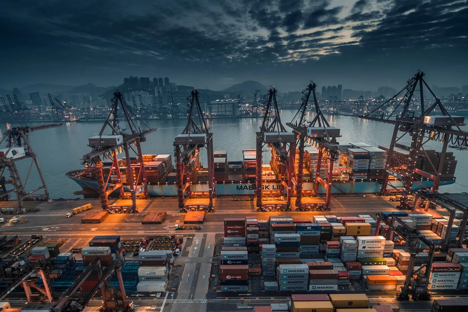 Aerial container port at dusk — global logistics and supply chain transformation